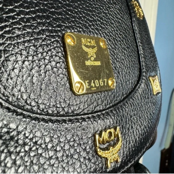 MCM Gold Studded Logo Black Pebbled Leather Backpack Tasseled Drawstring - Picture 3 of 15